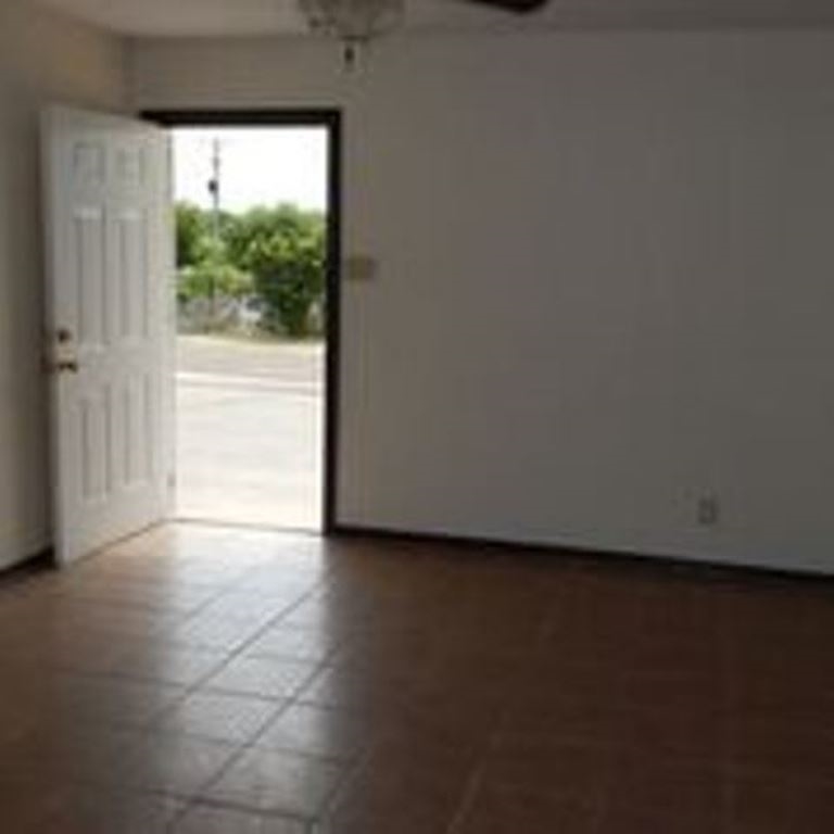 3202 Chacota Street Laredo, TX 78046 - Photo 3 of 11 a view of an empty room and window