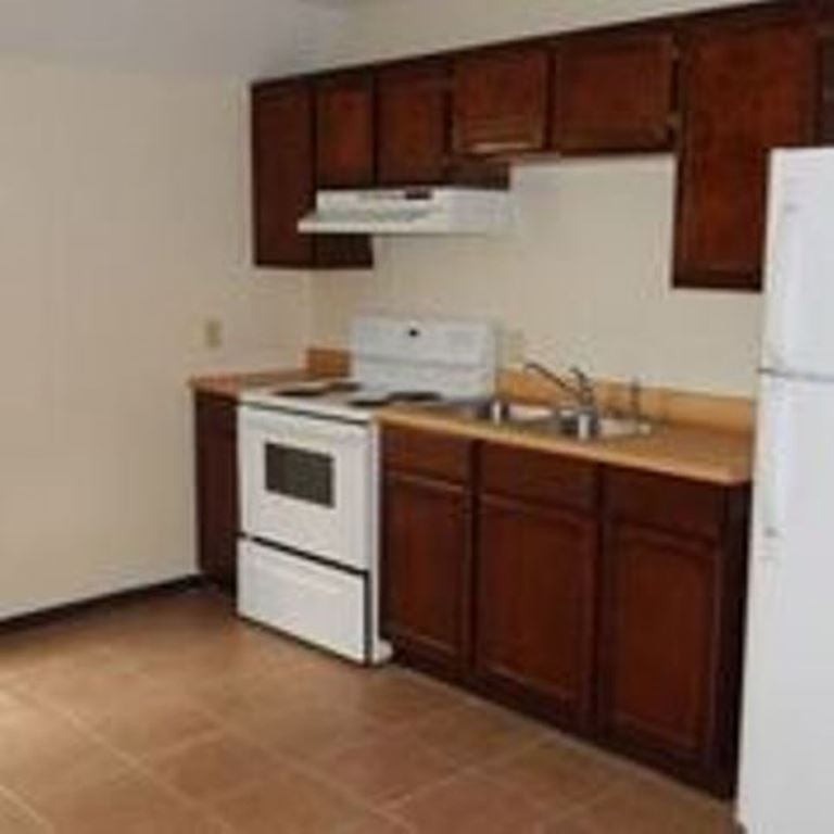 3202 Chacota Street Laredo, TX 78046 - Photo 5 of 11 a kitchen with stainless steel appliances granite countertop a sink stove and microwave
