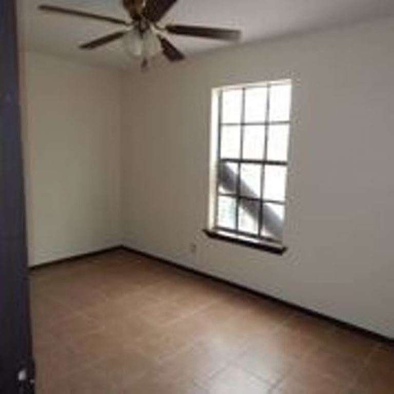 3202 Chacota Street Laredo, TX 78046 - Photo 6 of 11 an empty room with a window