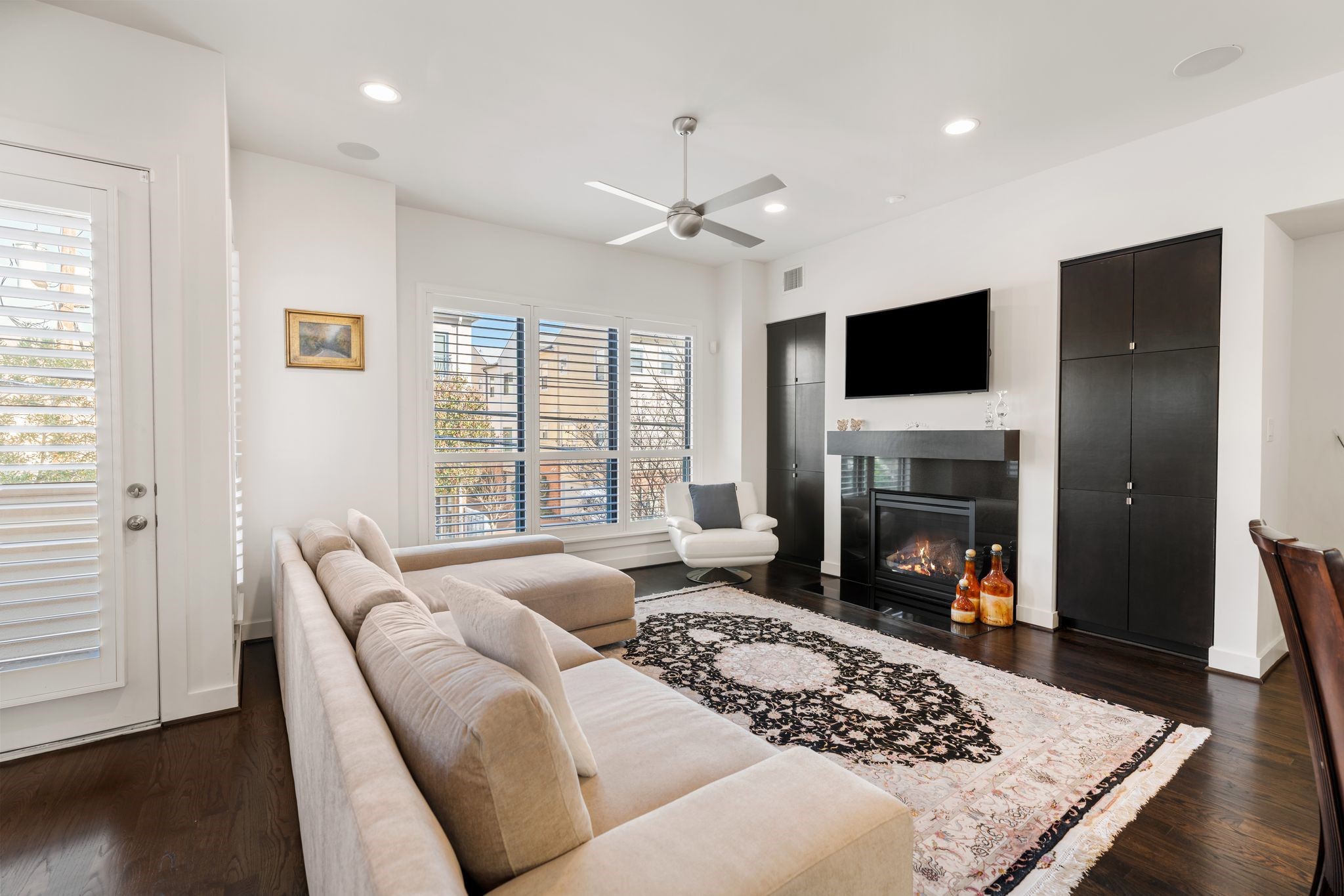 5911 Rose Street Houston, TX 77007 - Photo 12 of 40 Expansive open-concept living space with engineered wood floors, high ceilings, and oversized windows—perfect for everyday living and entertaining.