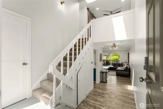 a living room with furniture and kitchen view