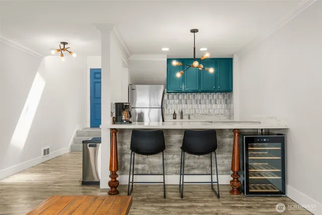 a kitchen with a refrigerator and a sink