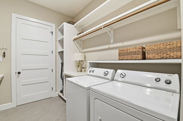 a kitchen with a sink cabinets and appliances