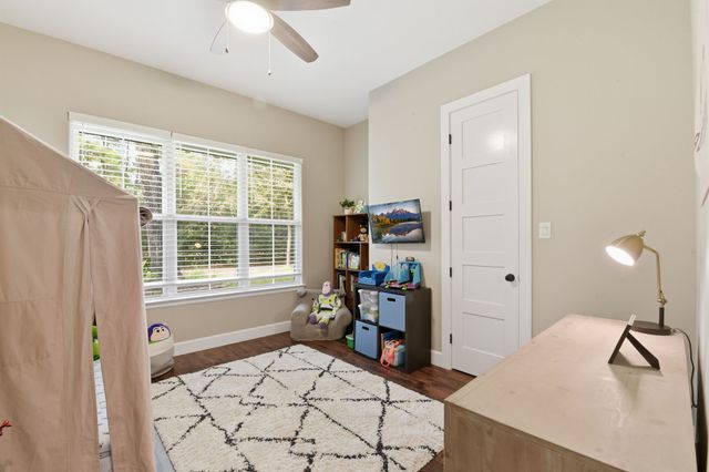 a bathroom with a double vanity sink a mirror and a shower