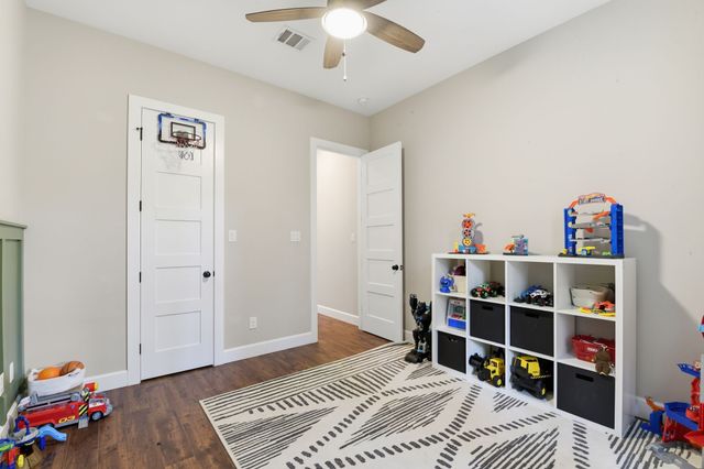 a view of an entryway with wooden floor