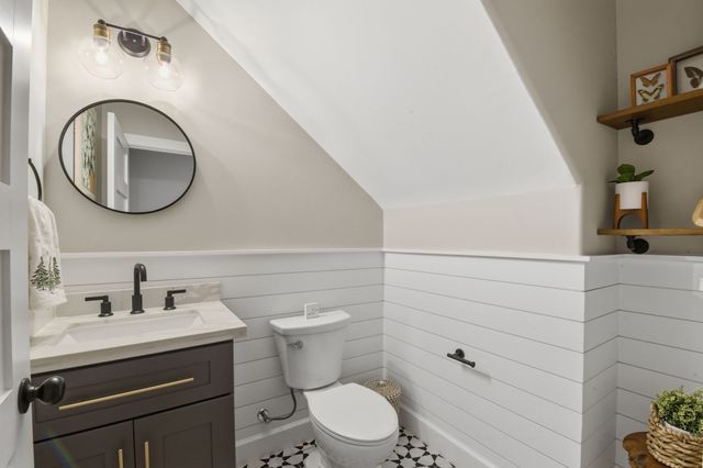 a living room with furniture and a rug