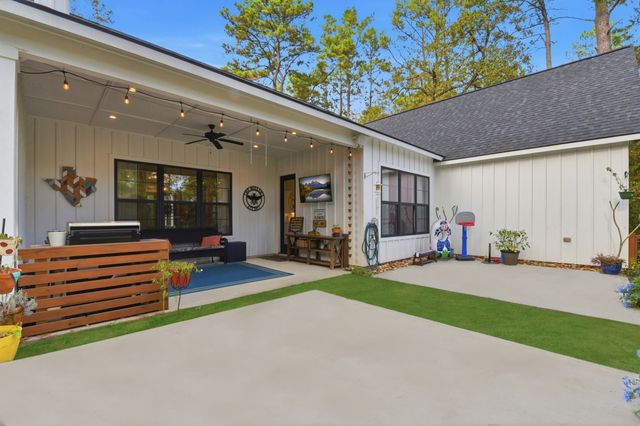 a living room with furniture a window and a table