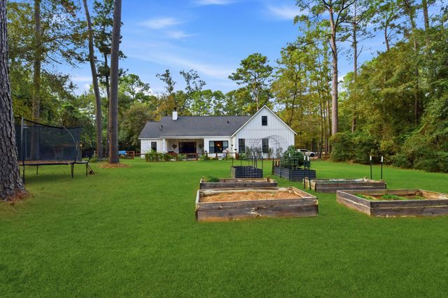 a view of backyard with swimming pool