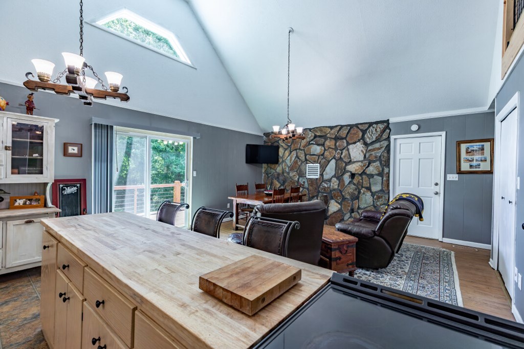 411 Piney Acres Road Blue Ridge, GA 30513 - Photo 18 of 72 a room with chandelier furniture and a chandelier