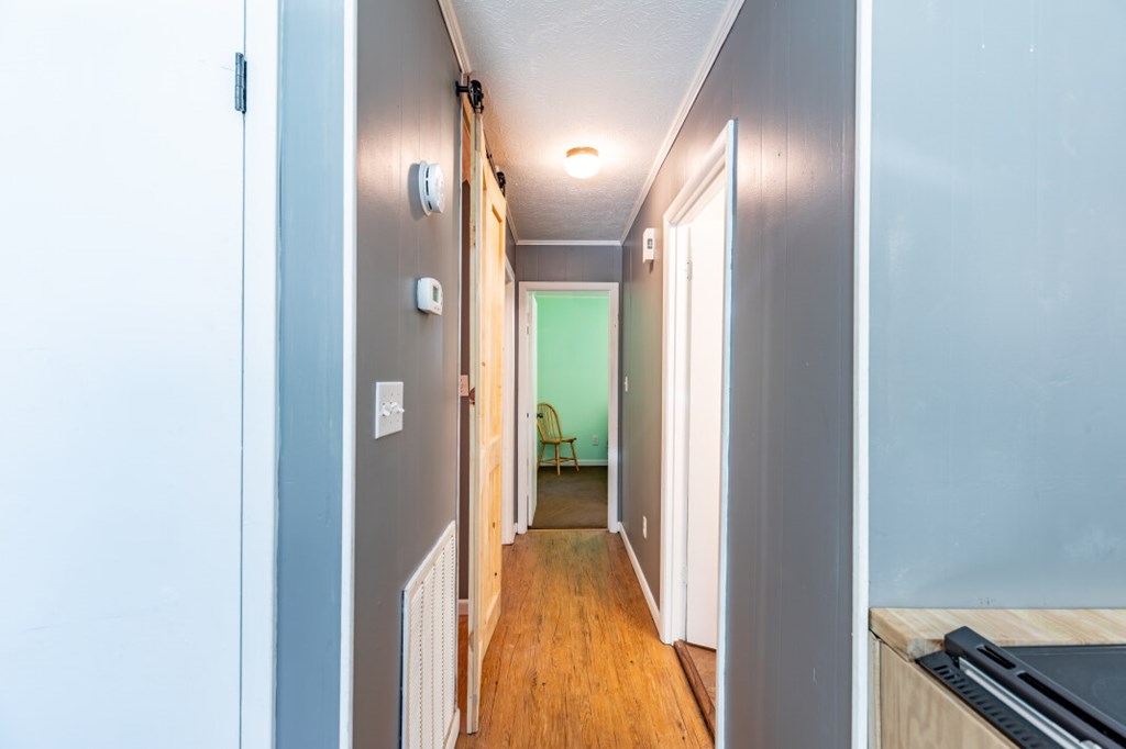 411 Piney Acres Road Blue Ridge, GA 30513 - Photo 23 of 72 a view of a hallway with wooden floor