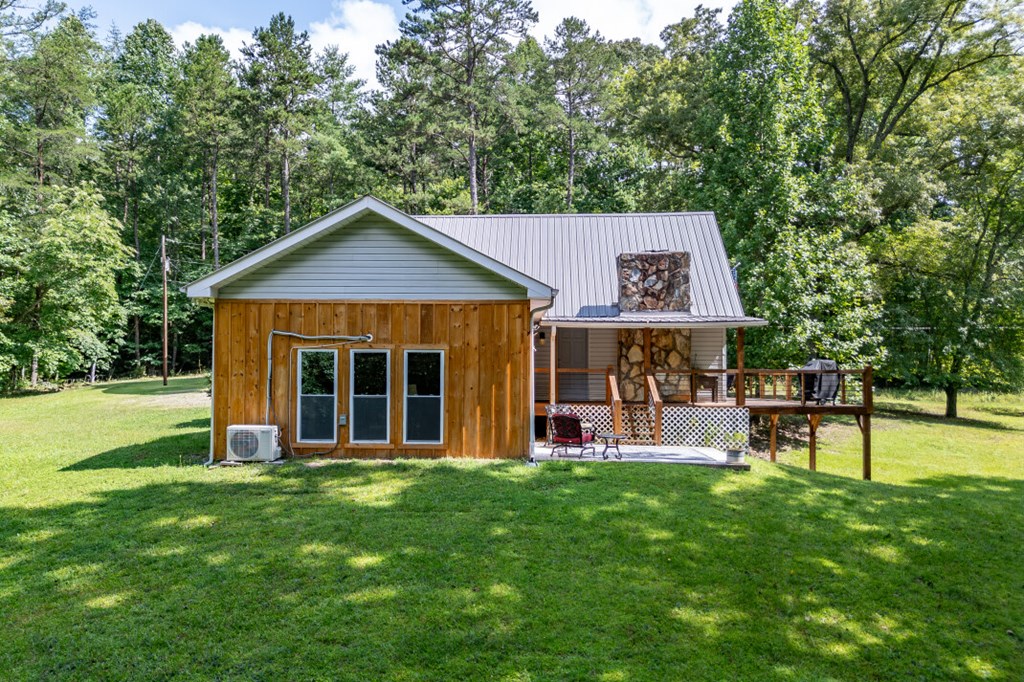 411 Piney Acres Road Blue Ridge, GA 30513 - Photo 3 of 72 a view of a house with a yard and sitting area