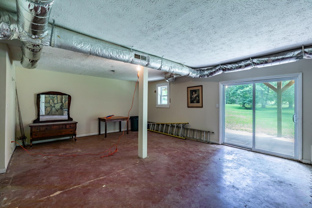 411 Piney Acres Road Blue Ridge, GA 30513 - Photo 31 of 72 a view of livingroom with furniture wooden floor and windows