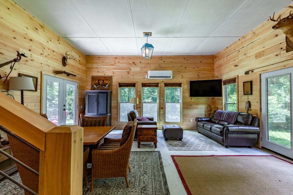 411 Piney Acres Road Blue Ridge, GA 30513 - Photo 47 of 72 a living room with furniture fireplace and flat screen tv