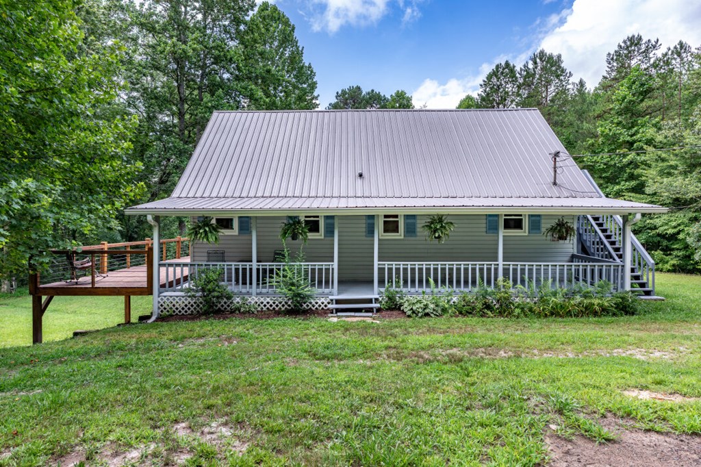411 Piney Acres Road Blue Ridge, GA 30513 - Photo 5 of 72 a view of a house with a yard and sitting area