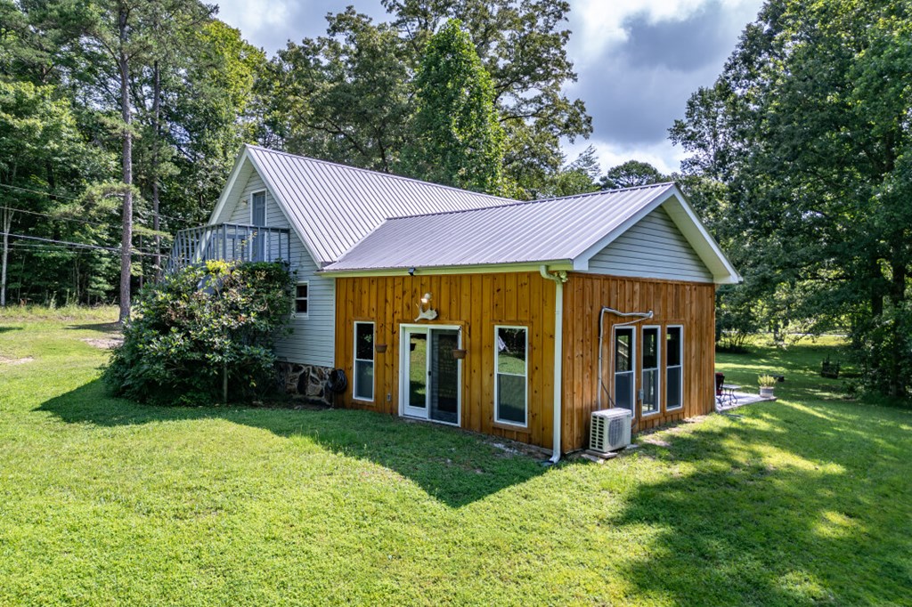 411 Piney Acres Road Blue Ridge, GA 30513 - Photo 56 of 72 a view of a house with garden and yard