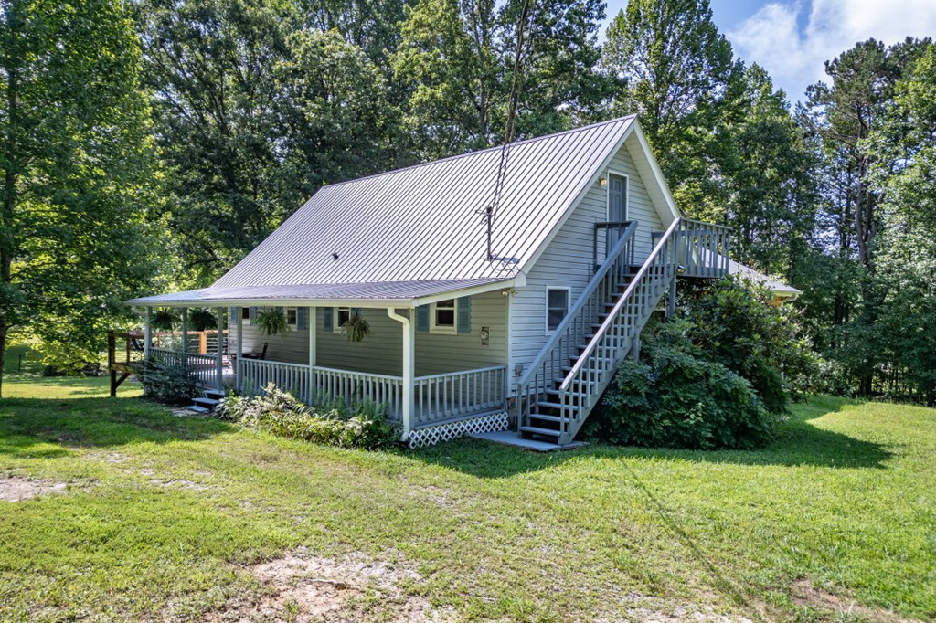411 Piney Acres Road Blue Ridge, GA 30513 - Photo 6 of 72 a view of a house with a yard