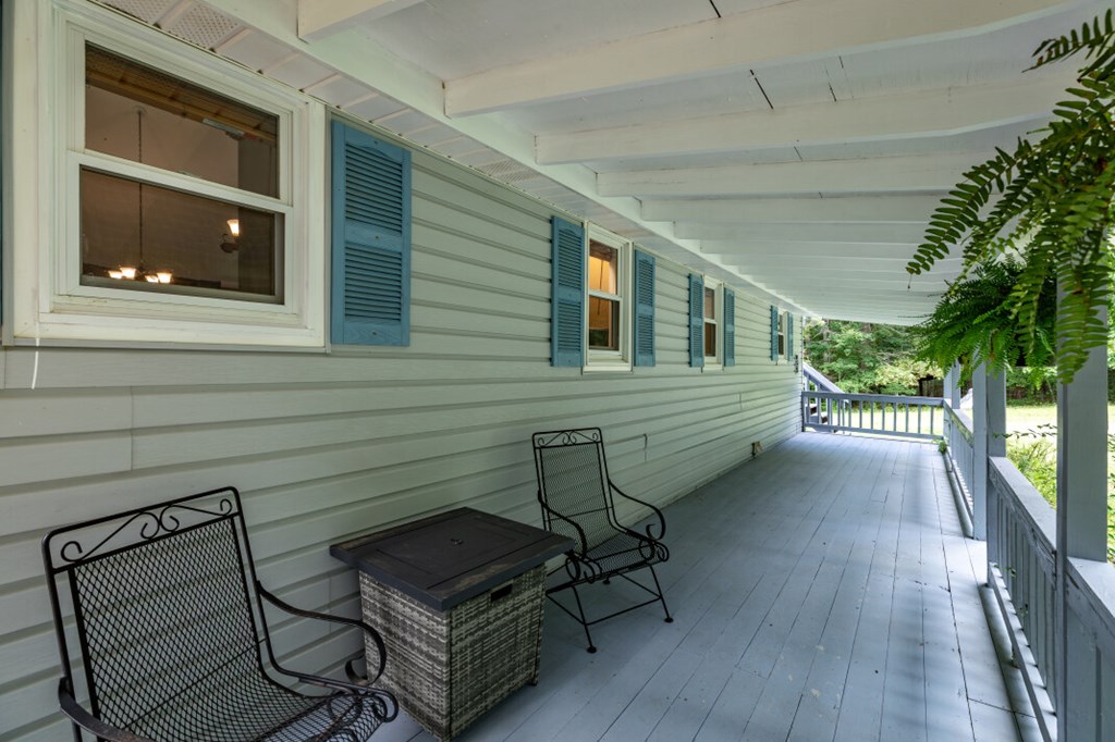 411 Piney Acres Road Blue Ridge, GA 30513 - Photo 8 of 72 a view of a chairs in the balcony