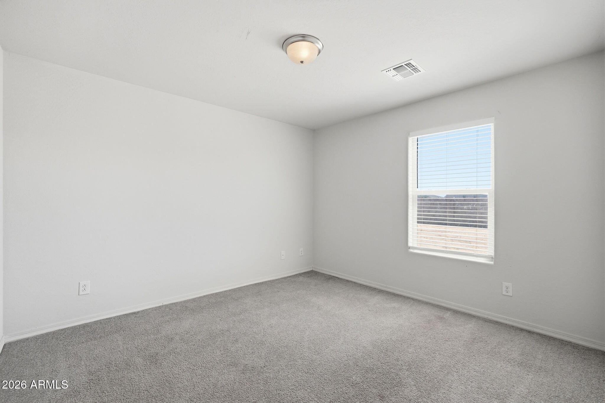 135 Watson Place Casa Grande, AZ 85122 - Photo 10 of 24 a view of an empty room with a window