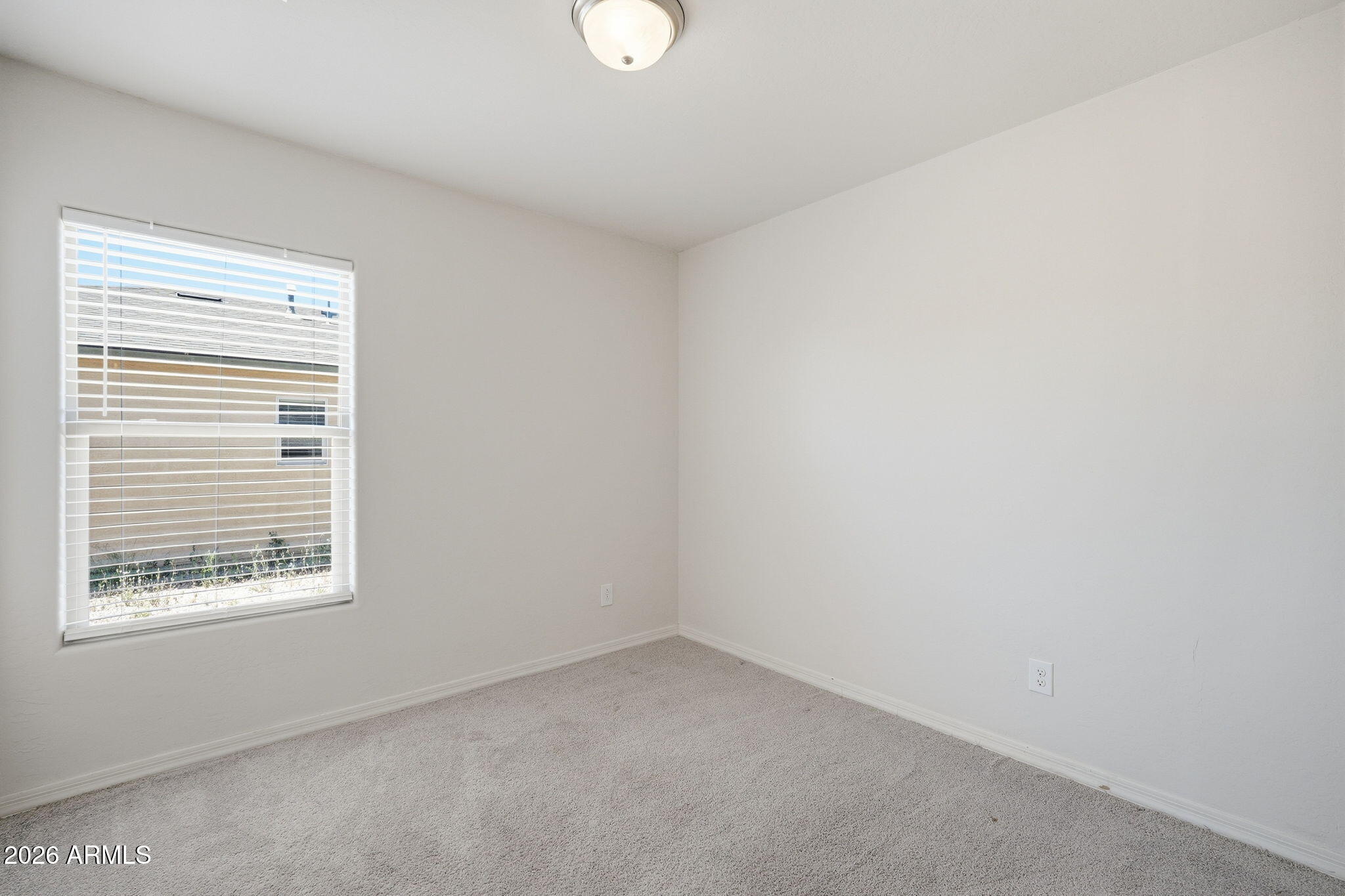 135 Watson Place Casa Grande, AZ 85122 - Photo 3 of 24 a view of an empty room with a window