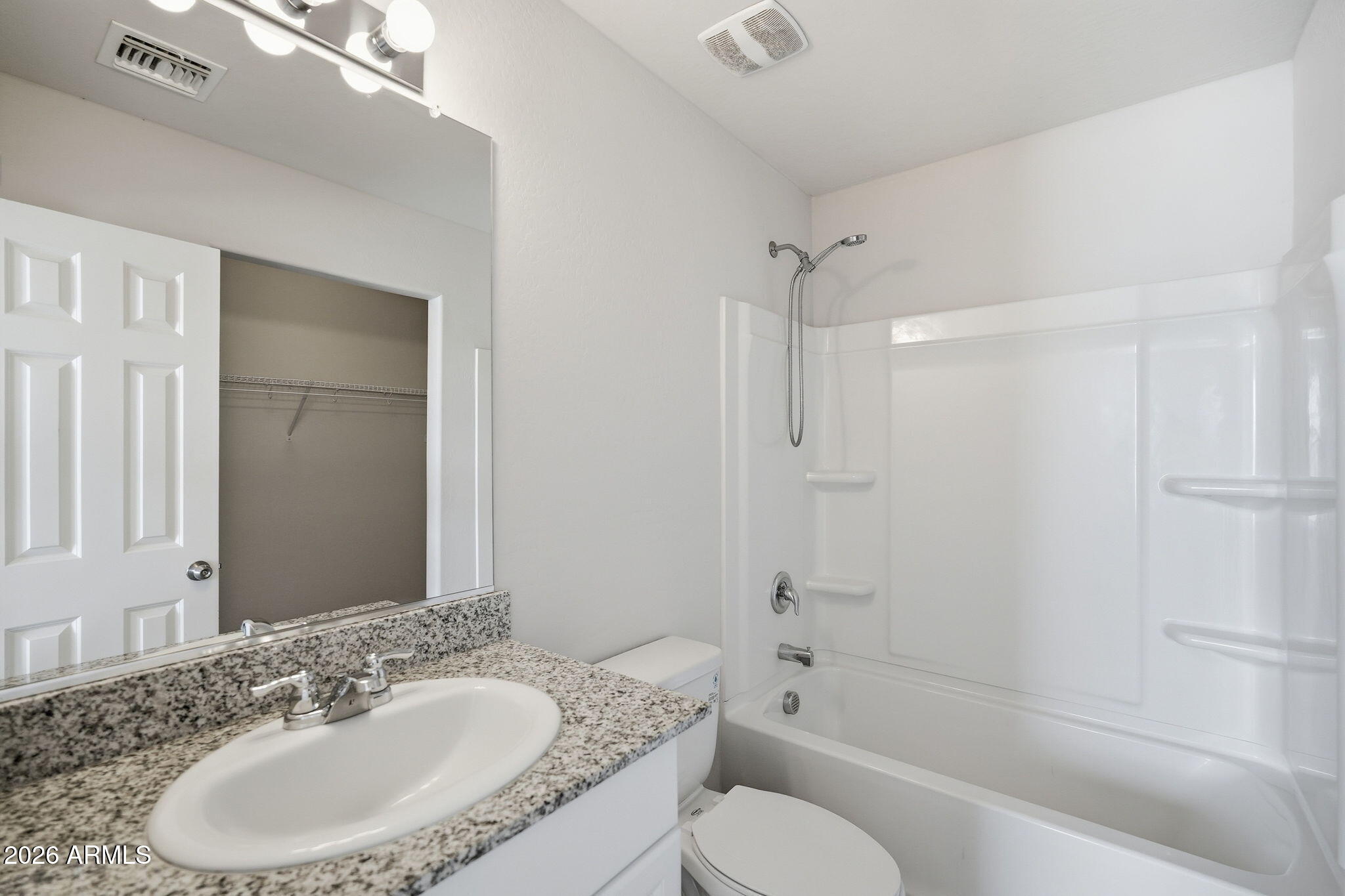 135 Watson Place Casa Grande, AZ 85122 - Photo 4 of 24 a bathroom with a granite countertop sink toilet and shower