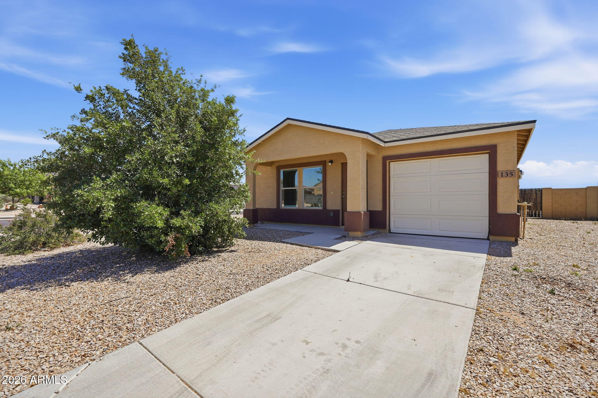 135 Watson Place Casa Grande, AZ 85122 - Photo 6 of 24 a front view of a house with a yard and garage