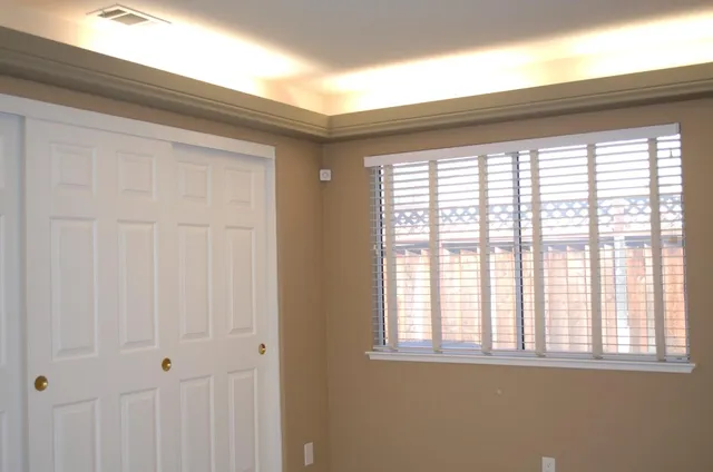a view of an empty room with a window