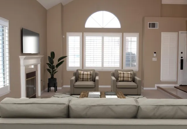 a living room with furniture and a large window