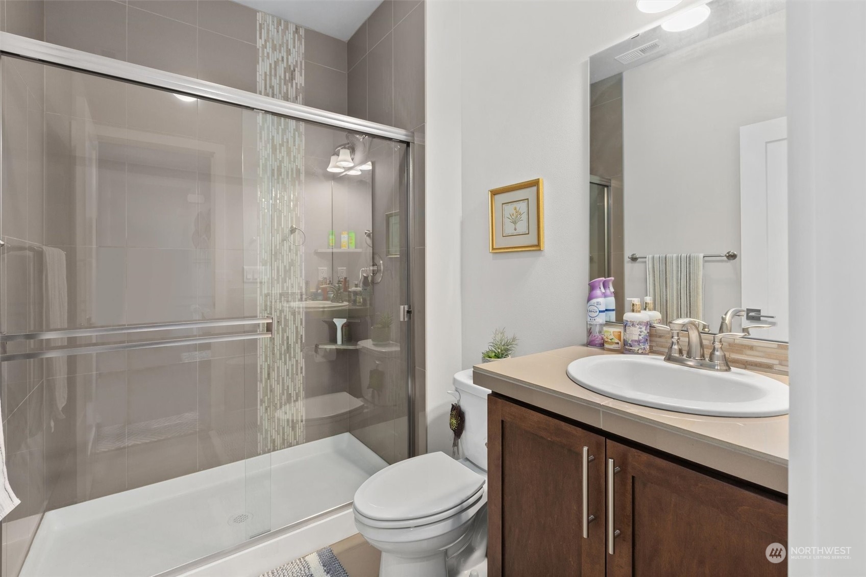 4765 Smithers Avenue South Renton, WA 98055 - Photo 13 of 38 a bathroom with a sink a toilet and shower