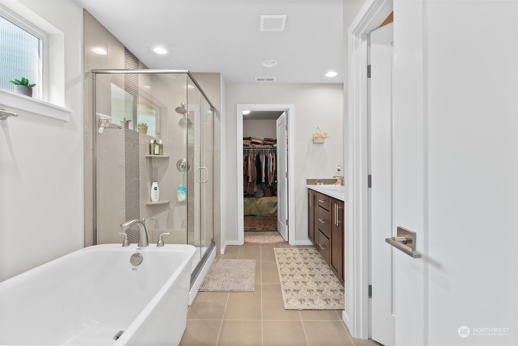4765 Smithers Avenue South Renton, WA 98055 - Photo 20 of 38 a bathroom with a bathtub shower and a sink