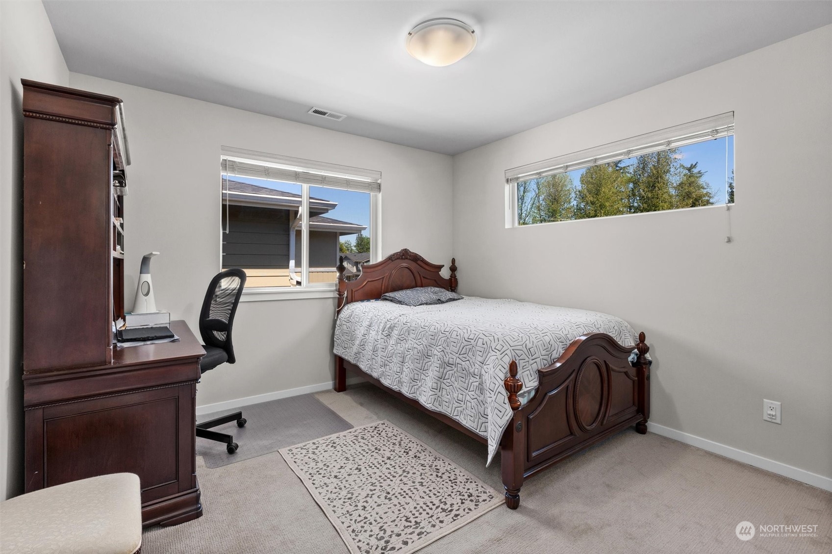 4765 Smithers Avenue South Renton, WA 98055 - Photo 22 of 38 a bedroom with a bed and wooden floor