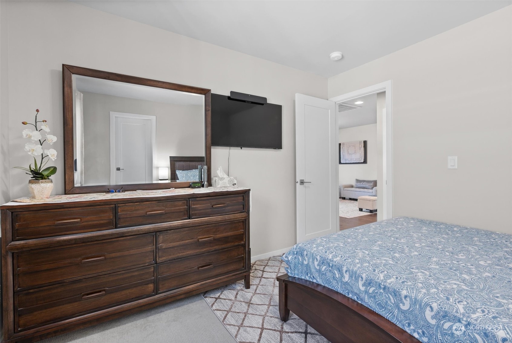4765 Smithers Avenue South Renton, WA 98055 - Photo 23 of 38 a bedroom with a bed and a mirror on dresser