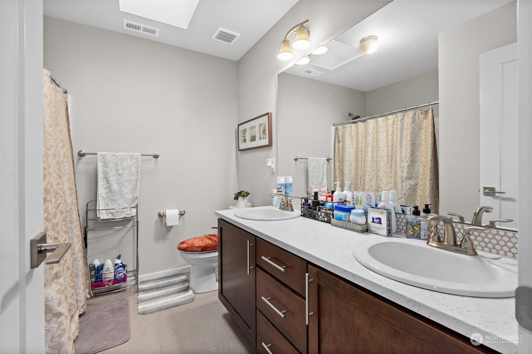 4765 Smithers Avenue South Renton, WA 98055 - Photo 24 of 38 a bathroom with a double vanity sink mirror and double