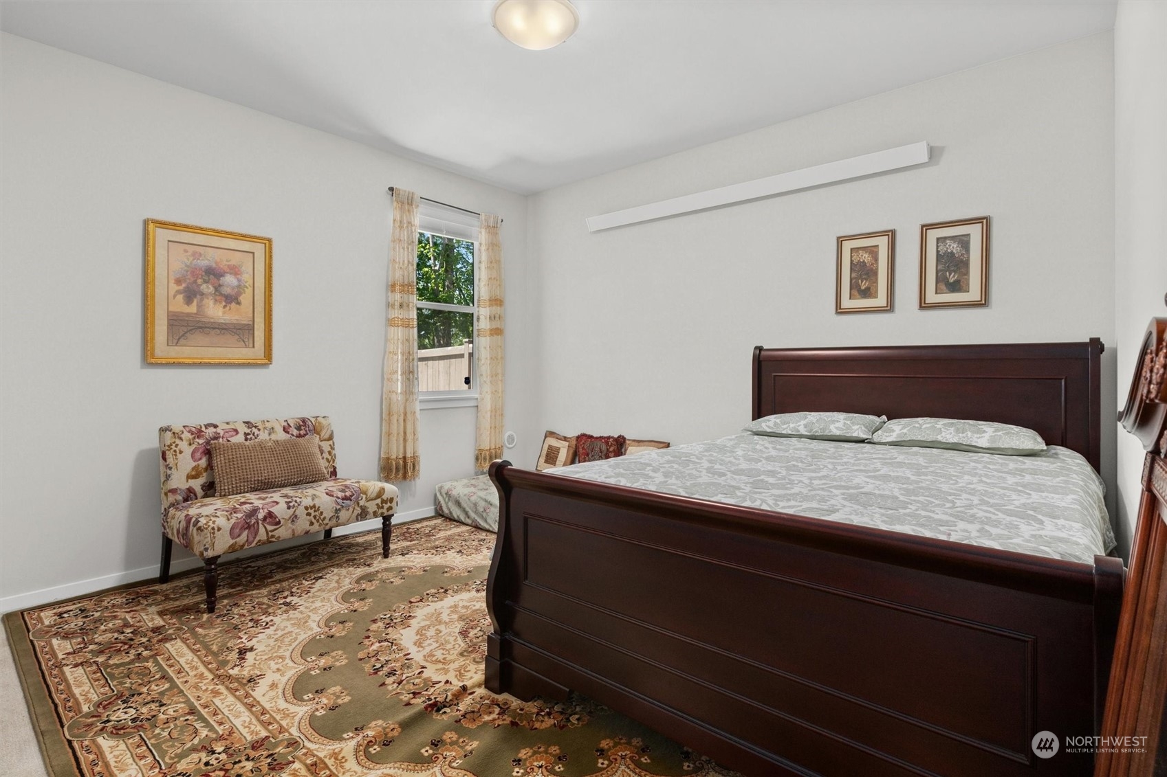 4765 Smithers Avenue South Renton, WA 98055 - Photo 29 of 38 a bedroom with a bed and a couch