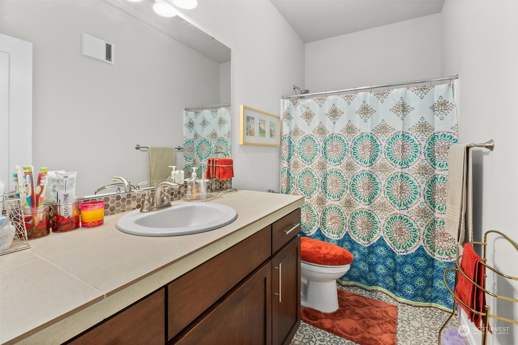 4765 Smithers Avenue South Renton, WA 98055 - Photo 30 of 38 a bathroom with a sink toilet mirror and shower