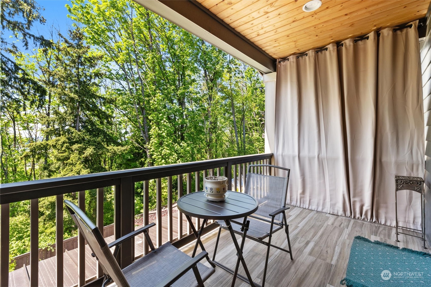 4765 Smithers Avenue South Renton, WA 98055 - Photo 35 of 38 a view of a balcony with furniture and wooden floor