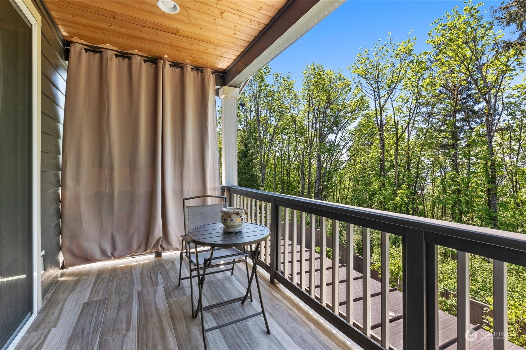 4765 Smithers Avenue South Renton, WA 98055 - Photo 36 of 38 a view of balcony with wooden floor and outdoor seating