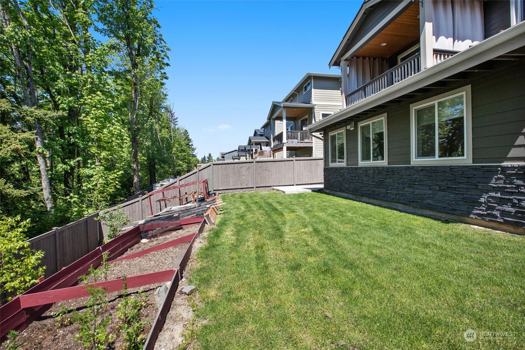 4765 Smithers Avenue South Renton, WA 98055 - Photo 38 of 38 a balcony with tall trees in the background