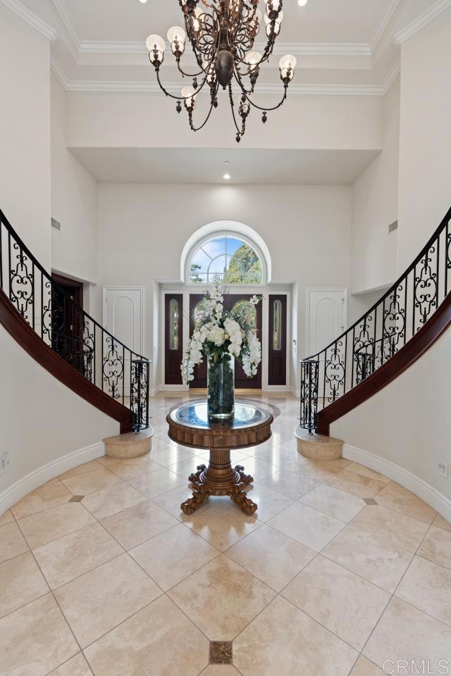 6773 Poco Lago Rancho Santa Fe, CA 92067 - Photo 11 of 65 a view of a livingroom with wooden floor furniture and a chandelier