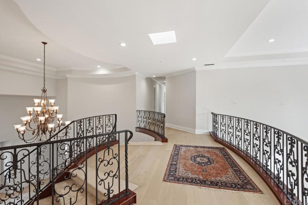 6773 Poco Lago Rancho Santa Fe, CA 92067 - Photo 12 of 65 a view of entryway dining room and hall with wooden floor
