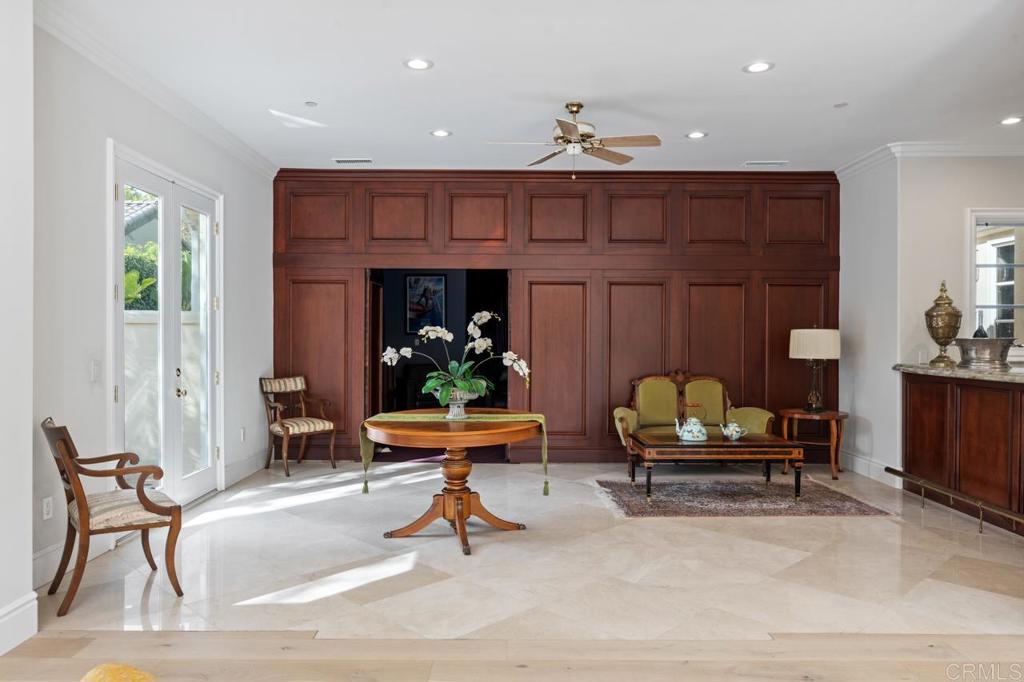 6773 Poco Lago Rancho Santa Fe, CA 92067 - Photo 29 of 65 a living room with furniture and a potted plant