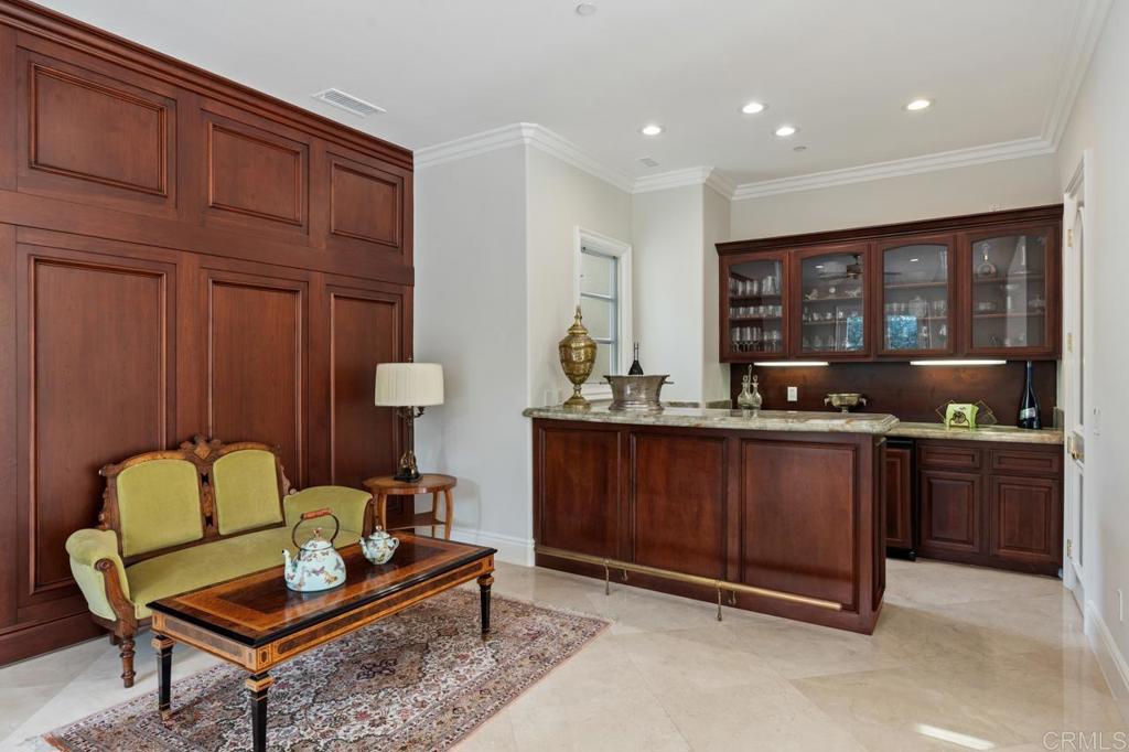 6773 Poco Lago Rancho Santa Fe, CA 92067 - Photo 30 of 65 a living room with furniture a window and a kitchen
