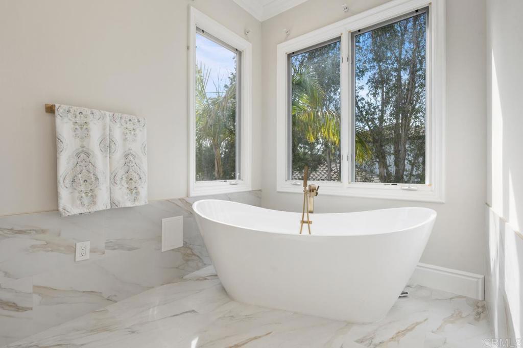6773 Poco Lago Rancho Santa Fe, CA 92067 - Photo 37 of 65 a white bath tub sitting in a bathroom next to a window