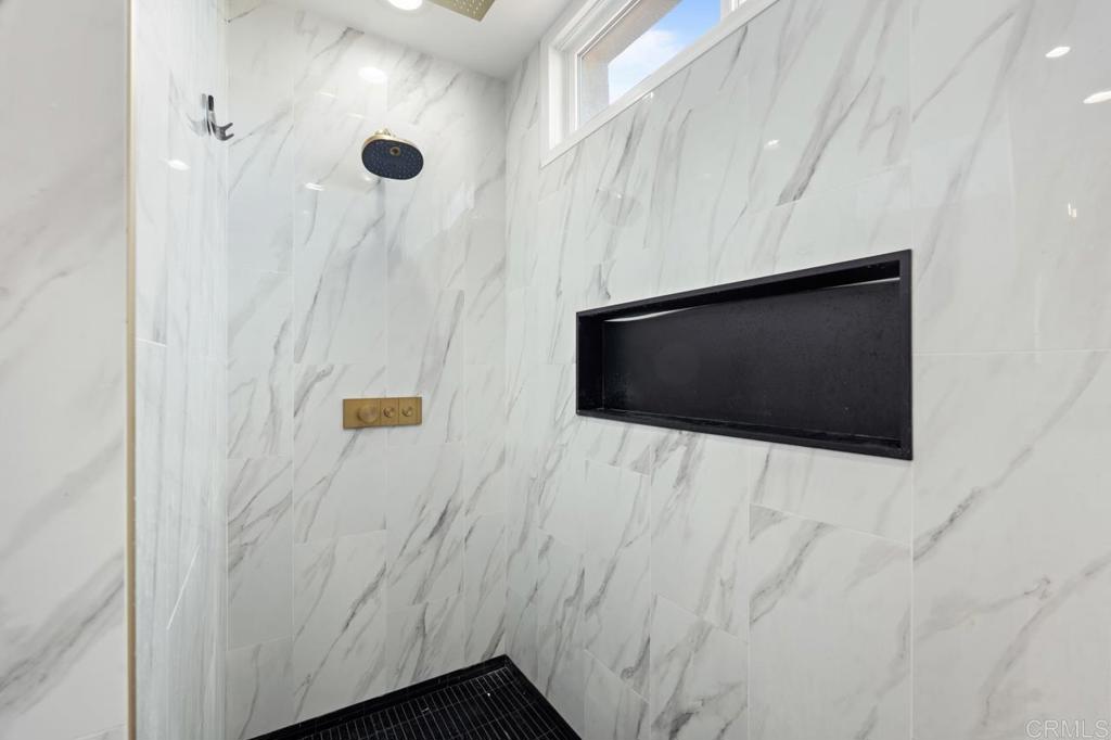 6773 Poco Lago Rancho Santa Fe, CA 92067 - Photo 38 of 65 a bathroom with a shower and a mirror