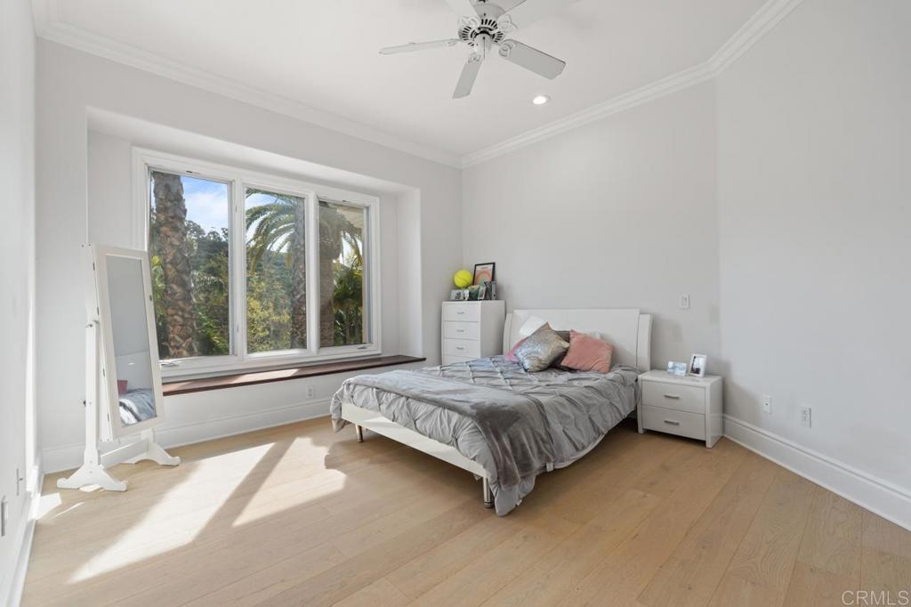 6773 Poco Lago Rancho Santa Fe, CA 92067 - Photo 40 of 65 a bedroom with a bed and a large window