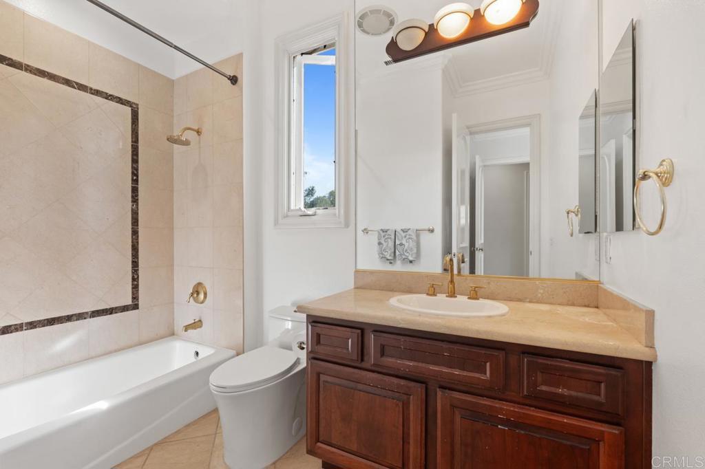 6773 Poco Lago Rancho Santa Fe, CA 92067 - Photo 41 of 65 a bathroom with a sink a toilet and shower
