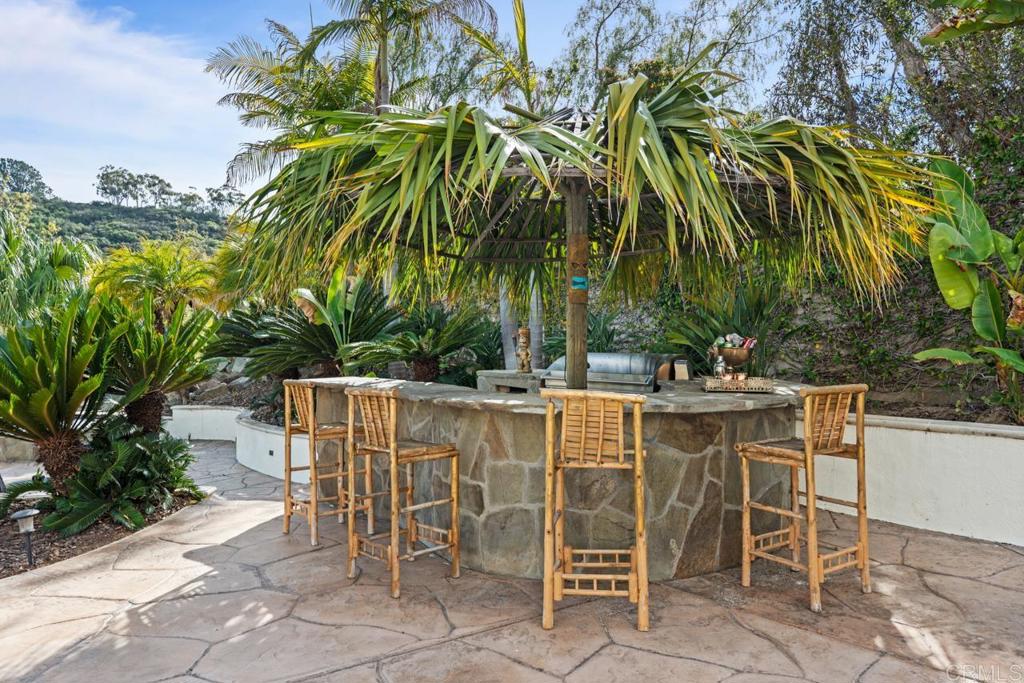 6773 Poco Lago Rancho Santa Fe, CA 92067 - Photo 43 of 65 a view of an outdoor space with a table and chair