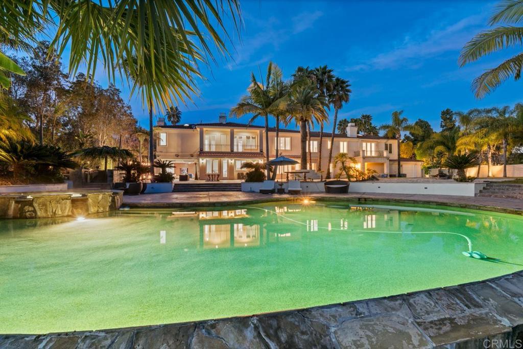 6773 Poco Lago Rancho Santa Fe, CA 92067 - Photo 49 of 65 a swimming pool with outdoor seating and yard