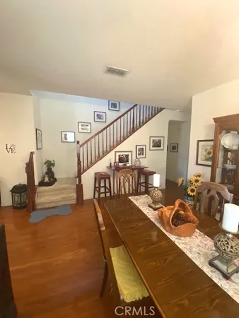 a living room with furniture chess floor and a window