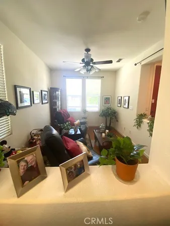 a bedroom with a bed dresser and mirror