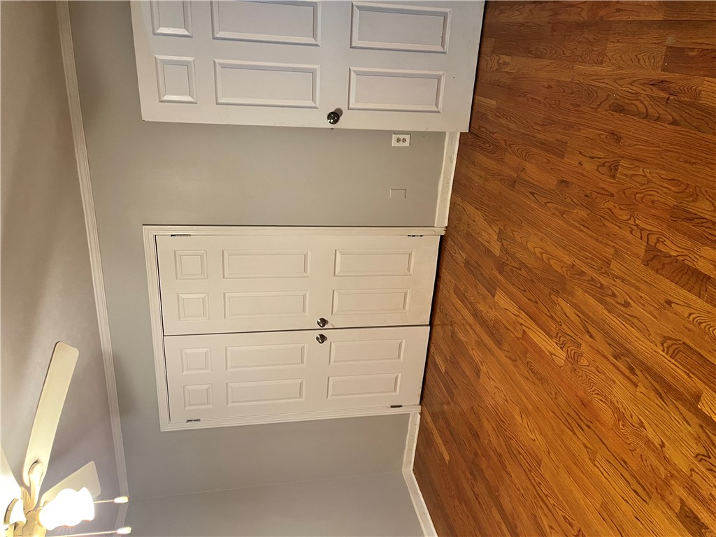 207 Pine Lane Anderson, SC 29621 - Photo 11 of 13 This interior showcases exquisite hardwood flooring, crown molding, and convenient closet access.